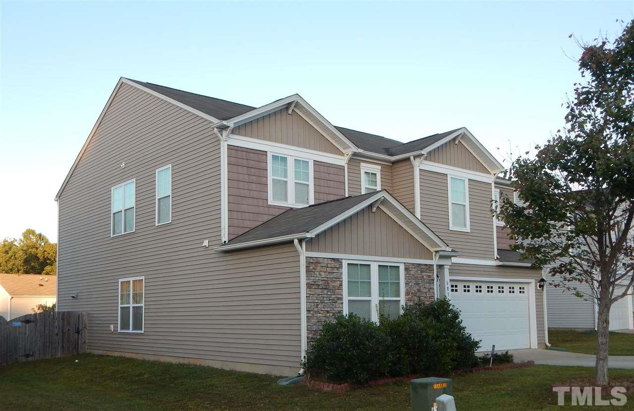 6835 Horseback Lane Raleigh, NC 27610 - Photo 23 of 25 a front view of a house with a yard