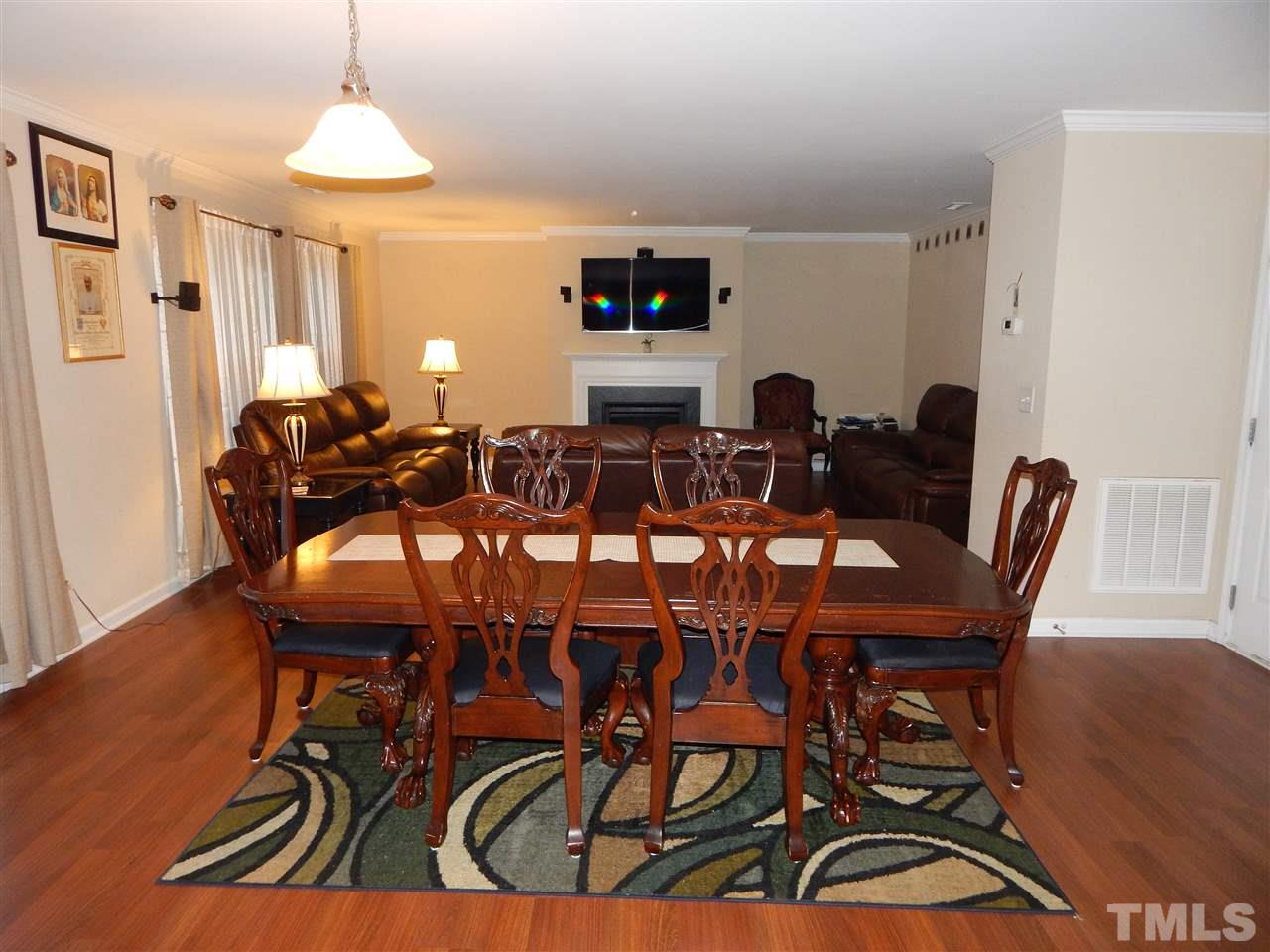6835 Horseback Lane Raleigh, NC 27610 - Photo 7 of 25 a view of a a dining room with furniture window and wooden floor