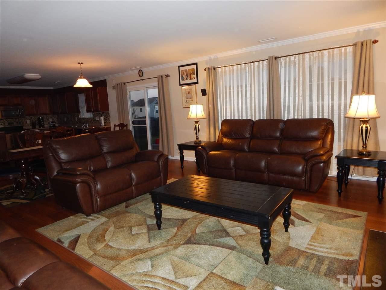 6835 Horseback Lane Raleigh, NC 27610 - Photo 8 of 25 a living room with furniture and a wooden floor