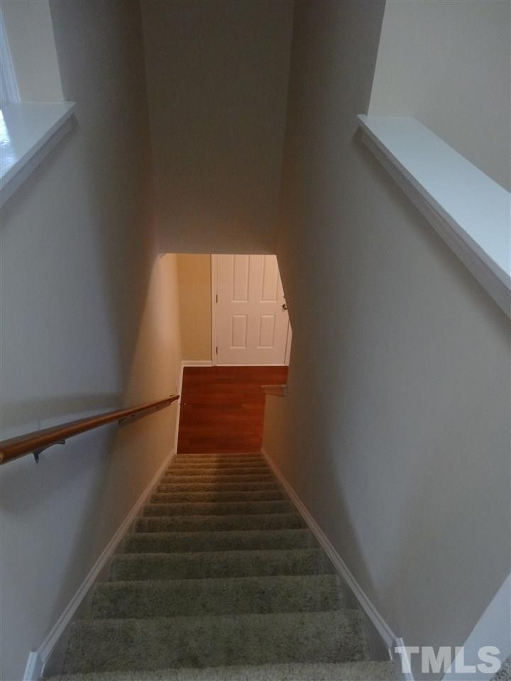 6835 Horseback Lane Raleigh, NC 27610 - Photo 10 of 25 a view of entryway and hall with wooden floor