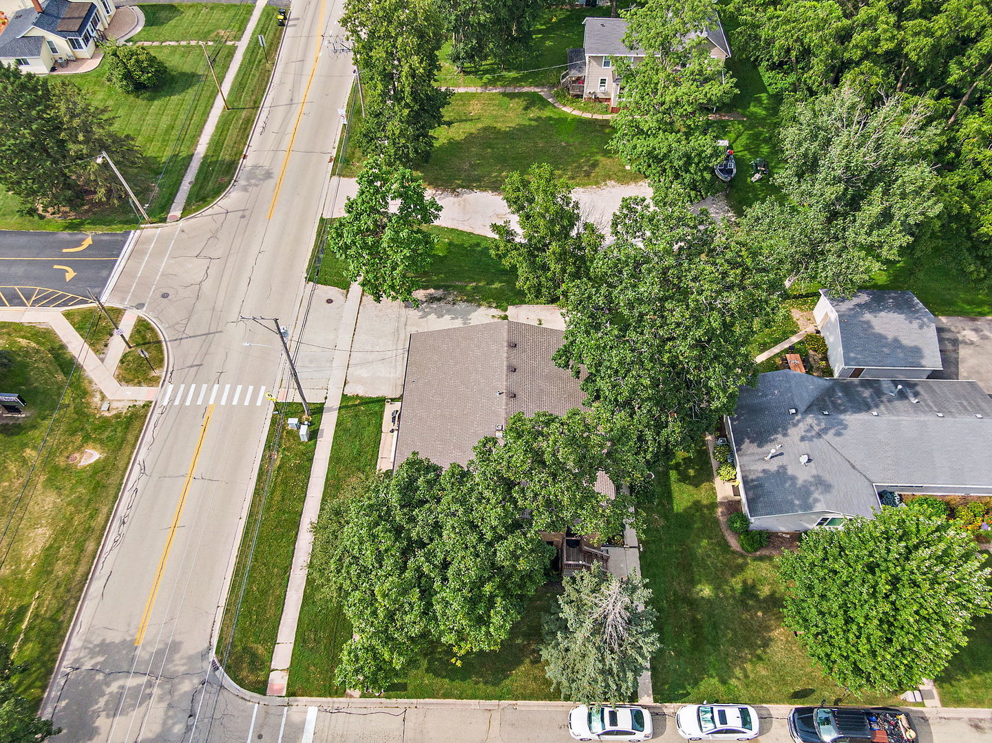 104 High Avenue, Unit C Hampshire, IL 60140 - Photo 20 of 22 an aerial view of residential house with outdoor space and trees all around