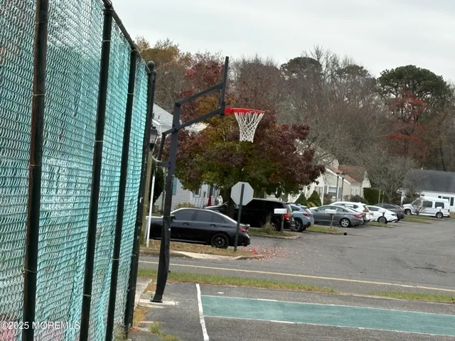 a view of street with parked cars