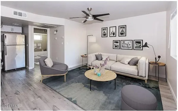 a living room with furniture and a table