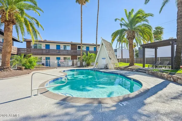 a view of a swimming pool with a lounge chairs
