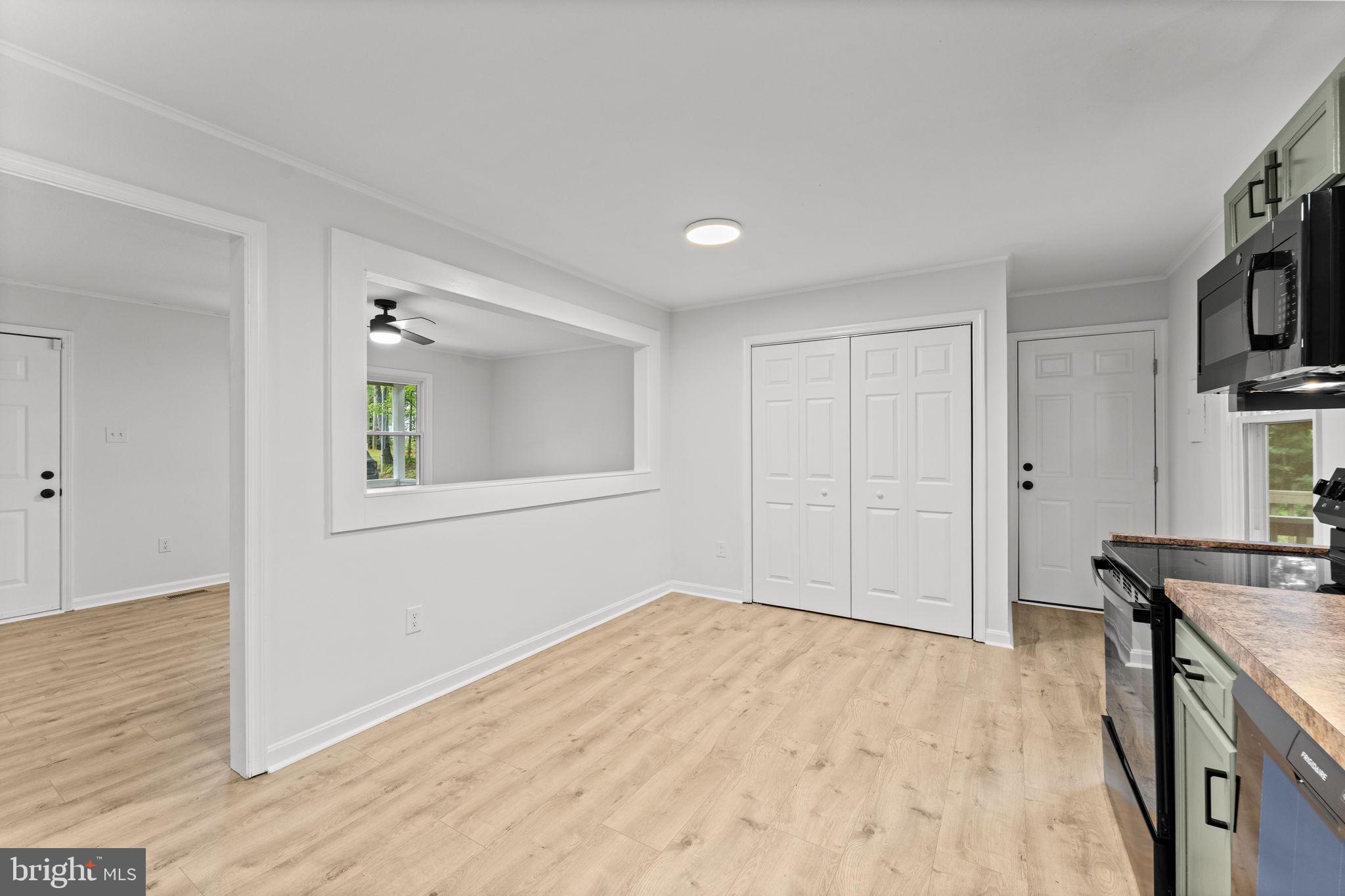 1821 James City Road Reva, VA 22735 - Photo 19 of 44 a view of livingroom with hardwood floor and a kitchen