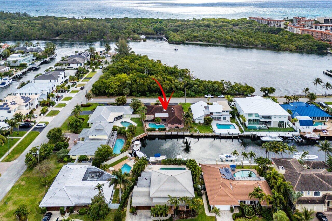 3163 Northeast 8th Avenue Boca Raton, FL 33431 - Photo 5 of 17 an aerial view of houses and lake