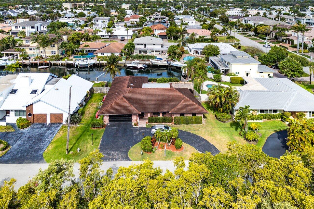 3163 Northeast 8th Avenue Boca Raton, FL 33431 - Photo 9 of 17 an aerial view of residential houses with outdoor space