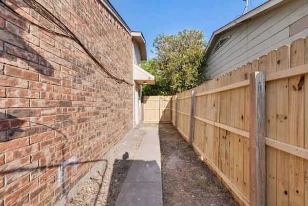 a view of a pathway with a building in the background