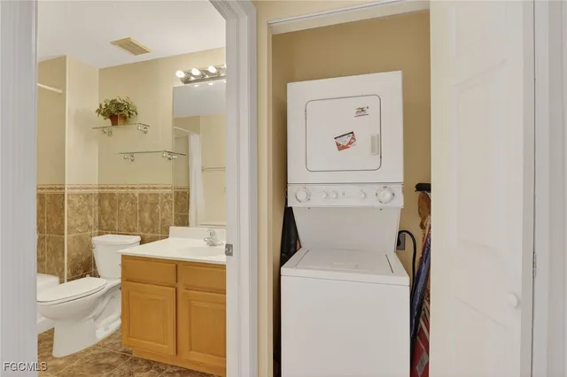 a bathroom with a toilet a sink and a mirror