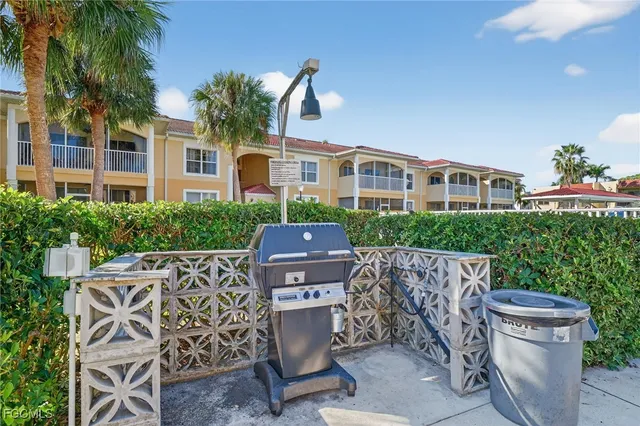 a view of a chairs and table in a patio