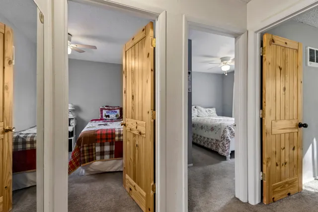 a view of a bedroom from a hallway