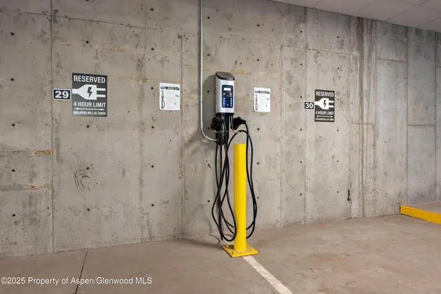 a front view of a residential houses with yard and trees