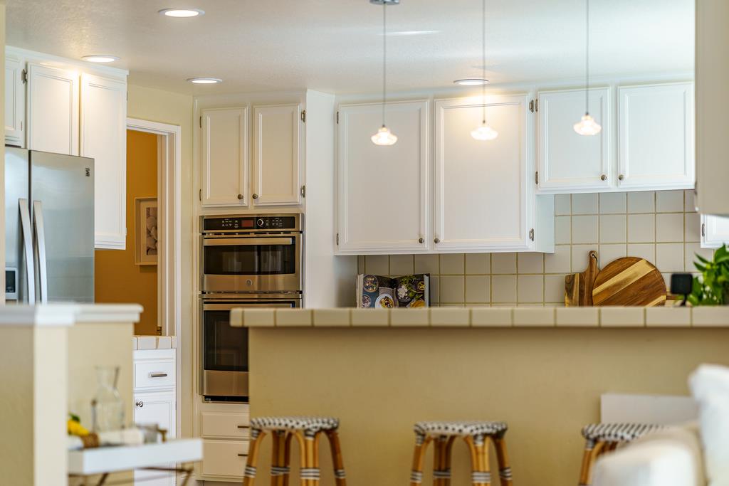 425 Canon Del Sol La Selva Beach, CA 95076 - Photo 14 of 59 a kitchen with stainless steel appliances granite countertop a sink and a refrigerator