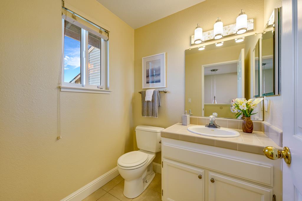 425 Canon Del Sol La Selva Beach, CA 95076 - Photo 17 of 59 a bathroom with a granite countertop toilet sink and mirror