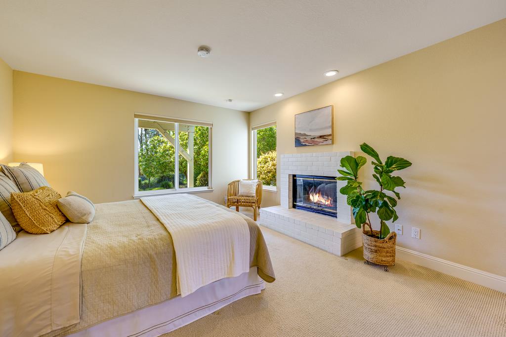 425 Canon Del Sol La Selva Beach, CA 95076 - Photo 24 of 59 a bedroom with a bed and a potted plant