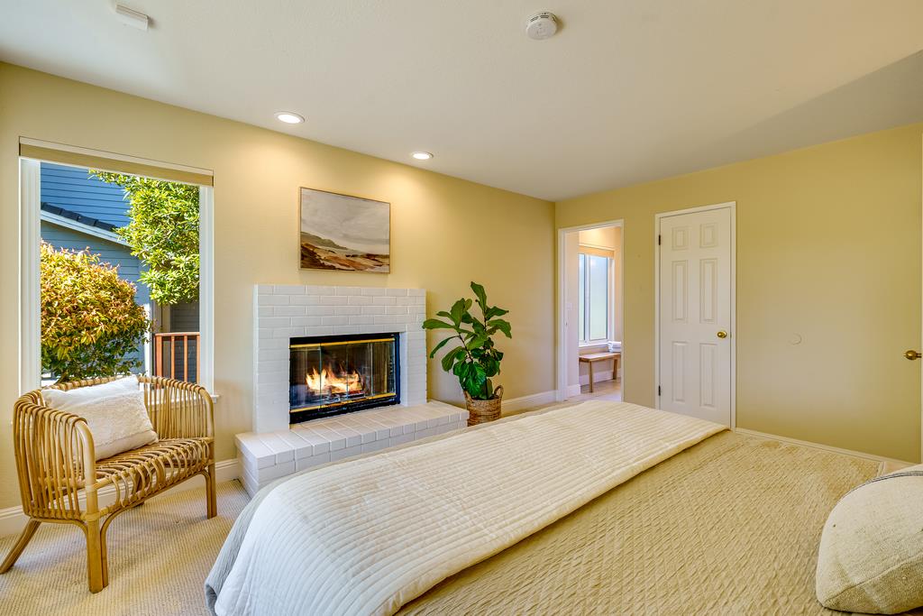 425 Canon Del Sol La Selva Beach, CA 95076 - Photo 26 of 59 a bedroom with a bed and a fireplace