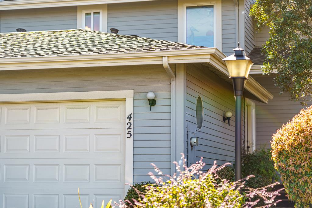 425 Canon Del Sol La Selva Beach, CA 95076 - Photo 34 of 59 a front view of a house with a yard and garage