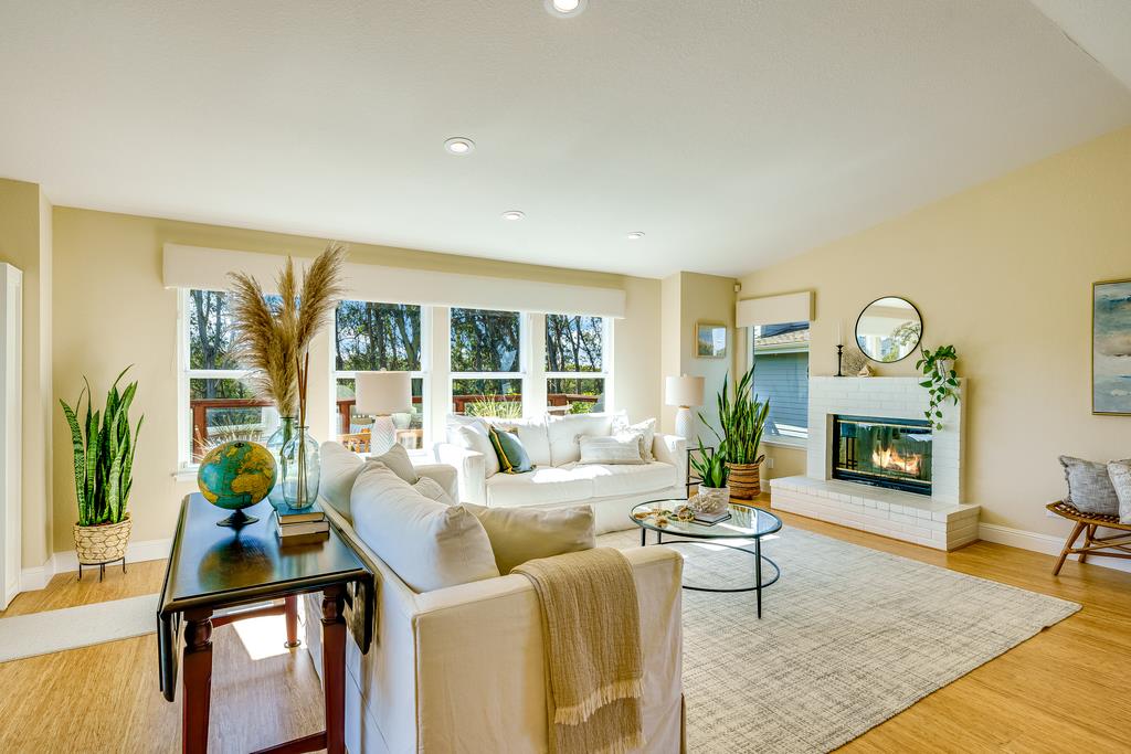 425 Canon Del Sol La Selva Beach, CA 95076 - Photo 4 of 59 a living room with furniture a fireplace a potted plant and a large window
