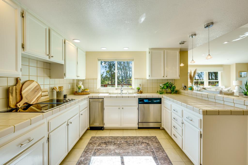 425 Canon Del Sol La Selva Beach, CA 95076 - Photo 5 of 59 a kitchen with a white cabinets and white appliances