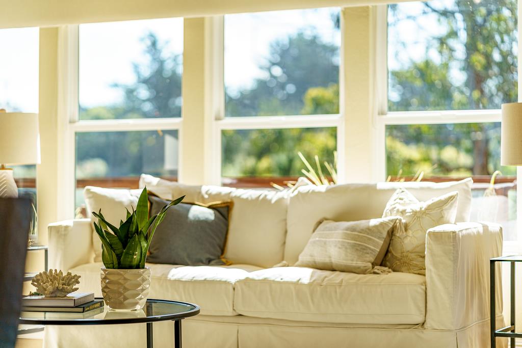 425 Canon Del Sol La Selva Beach, CA 95076 - Photo 9 of 59 a living room with large window couches and kitchen view