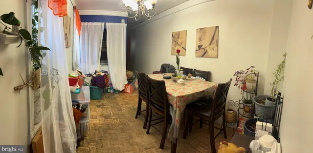 a dining room with a table and chairs