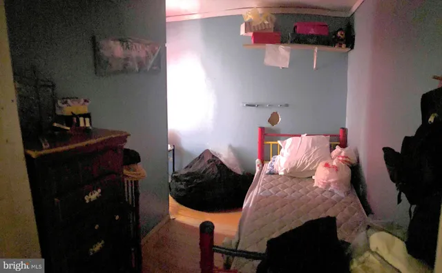 a bedroom with a bed and cabinets