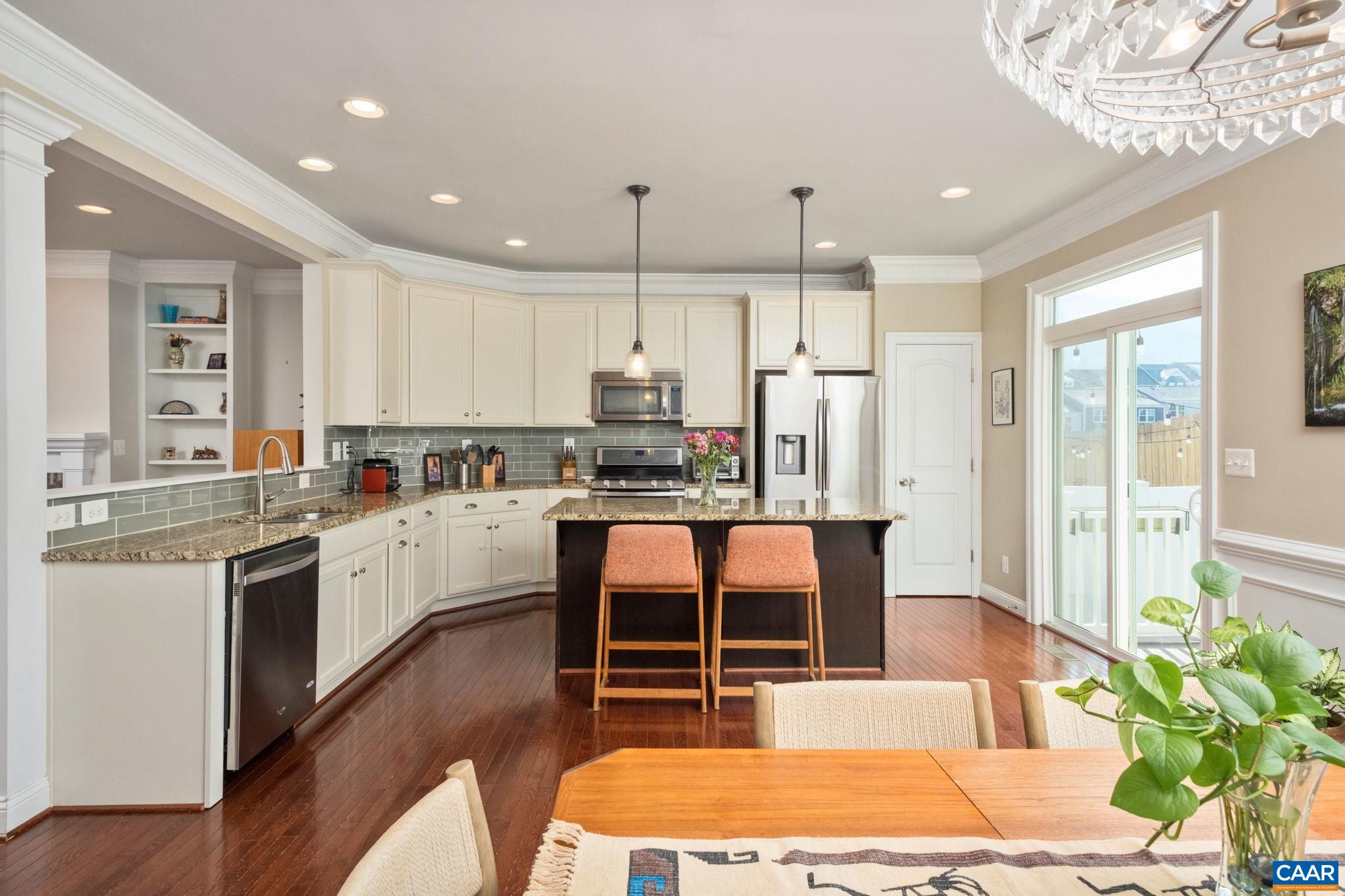2138 Avinity Loop Charlottesville, VA 22902 - Photo 14 of 49 a large kitchen with kitchen island a large counter top stainless steel appliances and cabinets