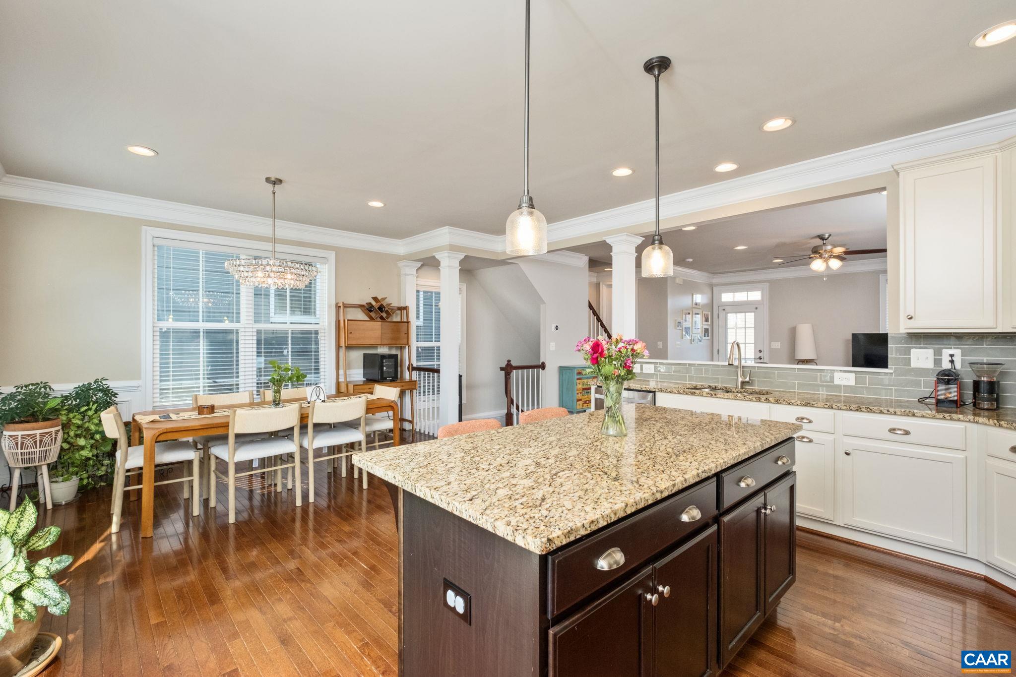 2138 Avinity Loop Charlottesville, VA 22902 - Photo 15 of 49 a kitchen with center island table and chairs