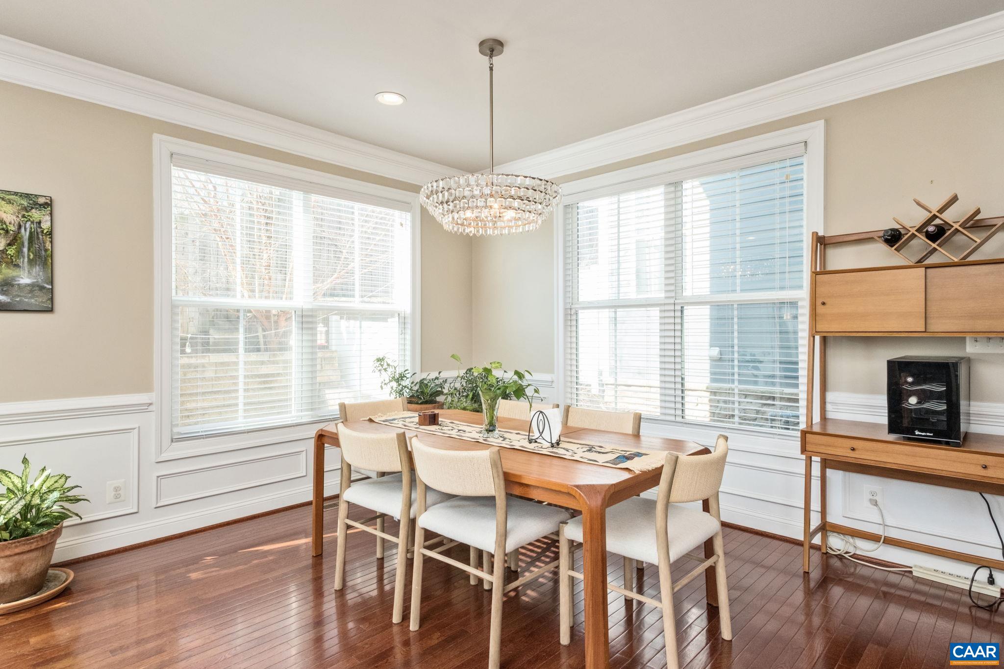 2138 Avinity Loop Charlottesville, VA 22902 - Photo 16 of 49 a dining room with furniture windows wooden floor and a chandelier