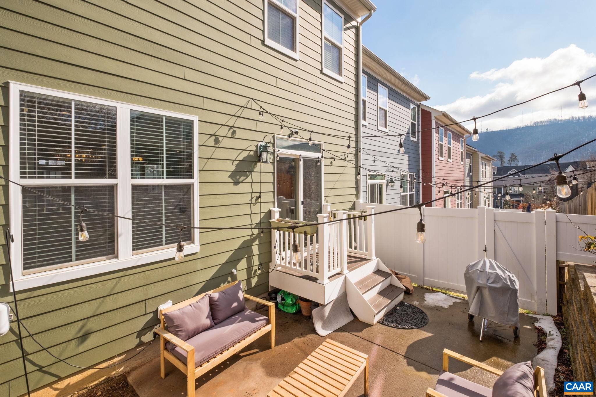 2138 Avinity Loop Charlottesville, VA 22902 - Photo 18 of 49 a view of a balcony with two chairs and a barbeque
