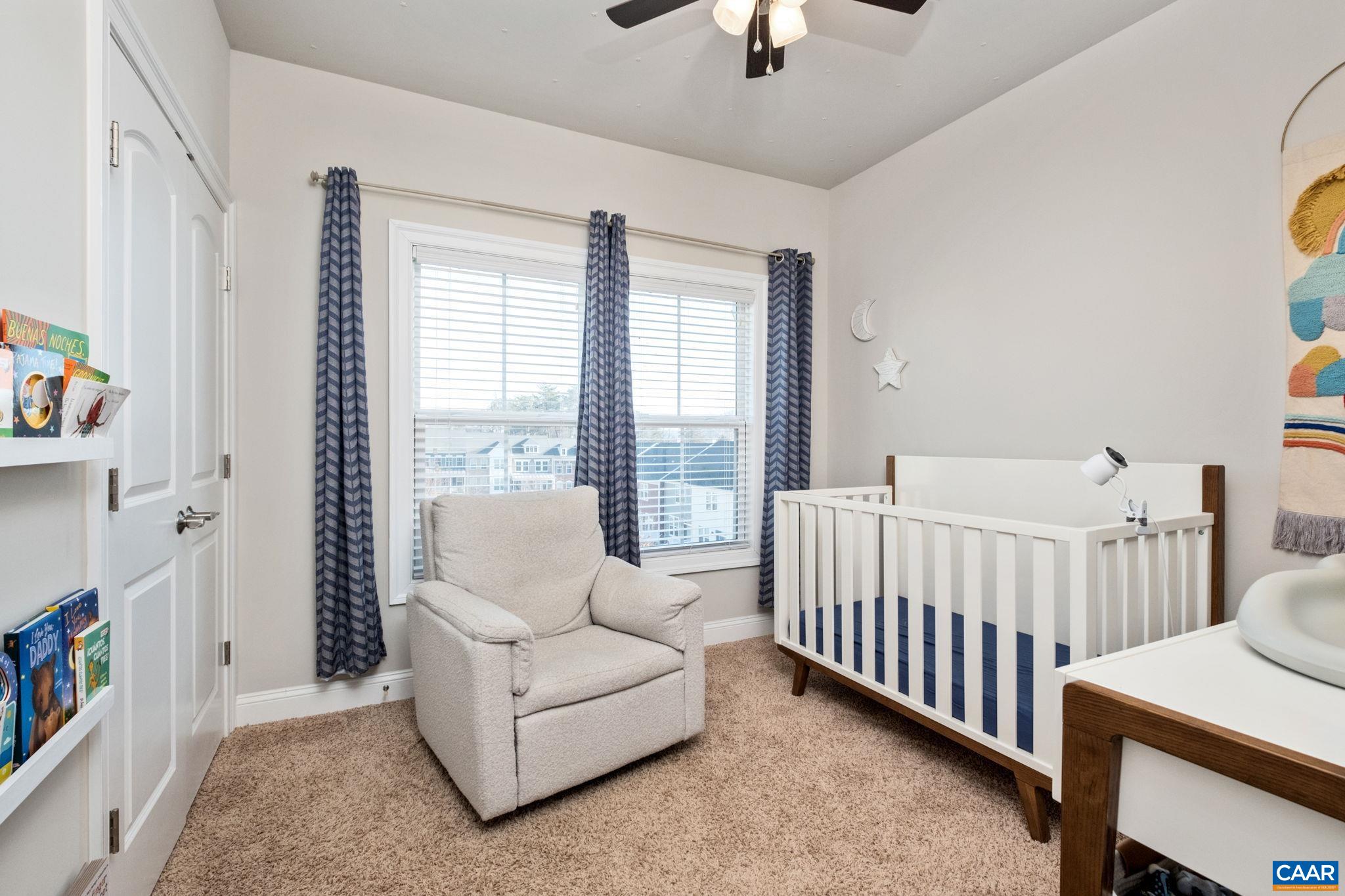 2138 Avinity Loop Charlottesville, VA 22902 - Photo 26 of 49 a bedroom with furniture and a large window