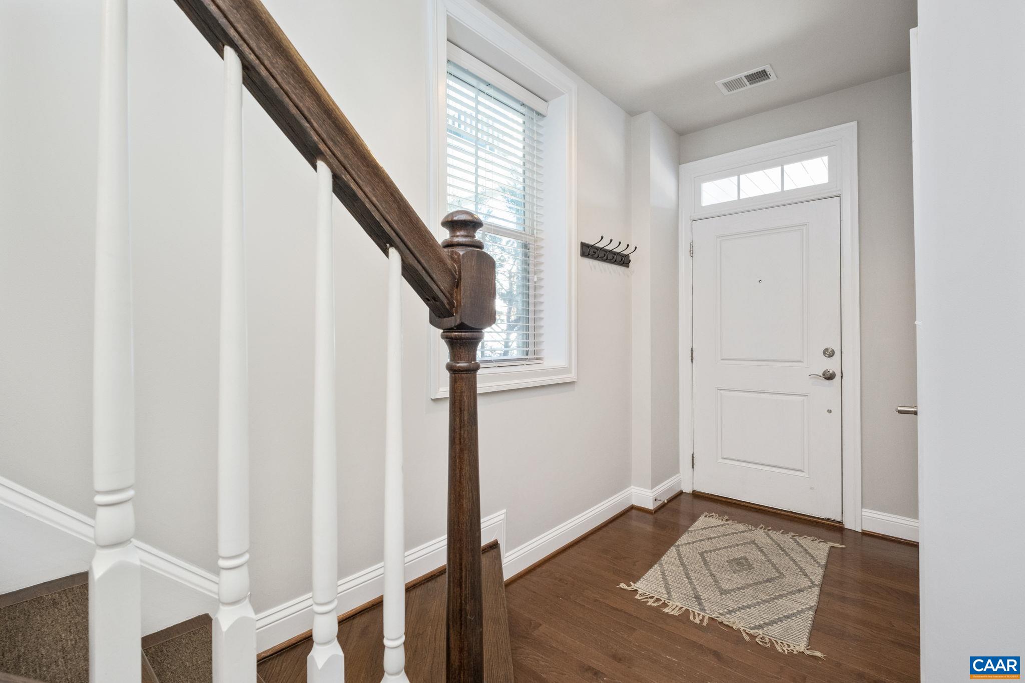 2138 Avinity Loop Charlottesville, VA 22902 - Photo 3 of 49 a view of entryway with wooden floor and stairs