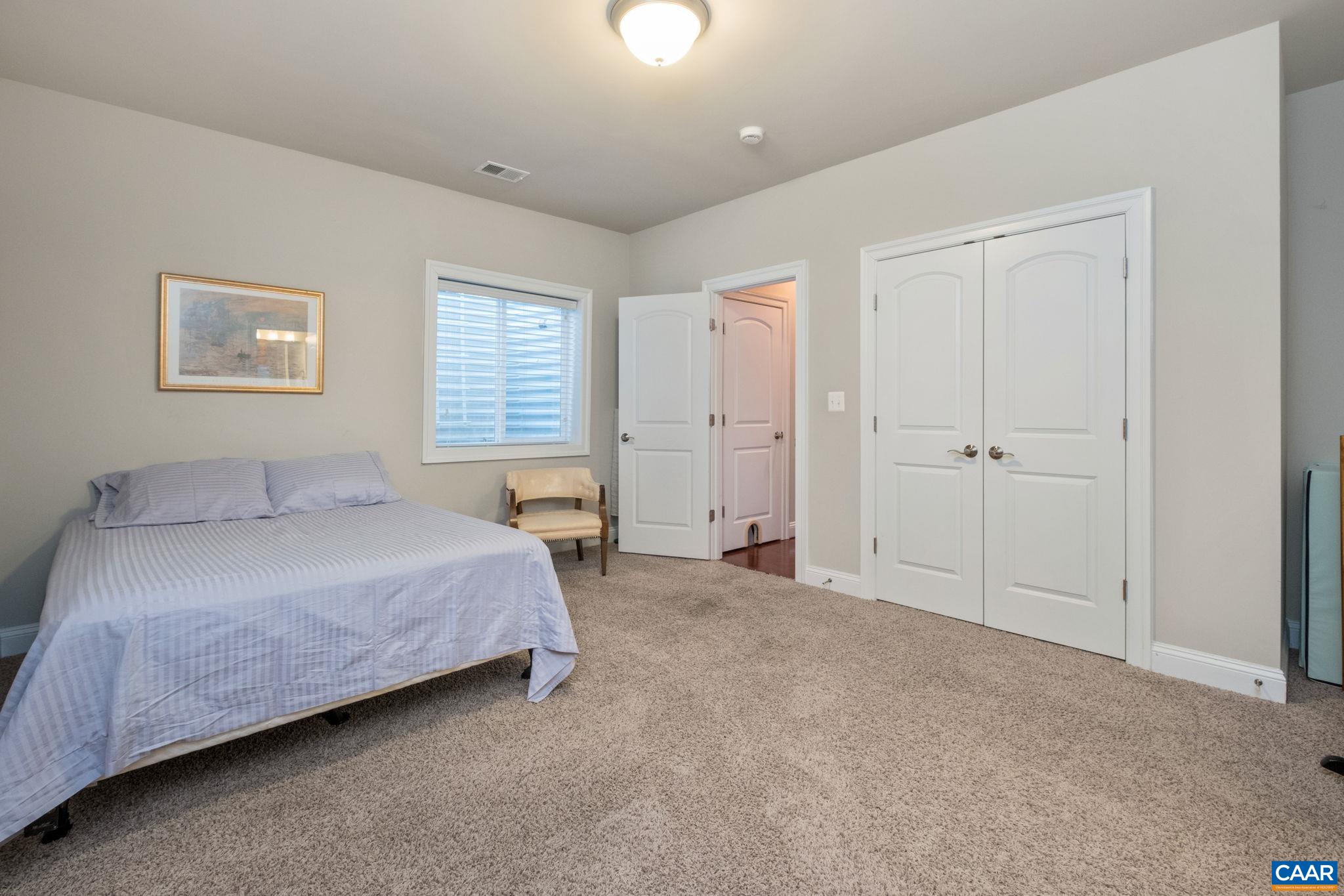 2138 Avinity Loop Charlottesville, VA 22902 - Photo 31 of 49 a bedroom with a bed and a window