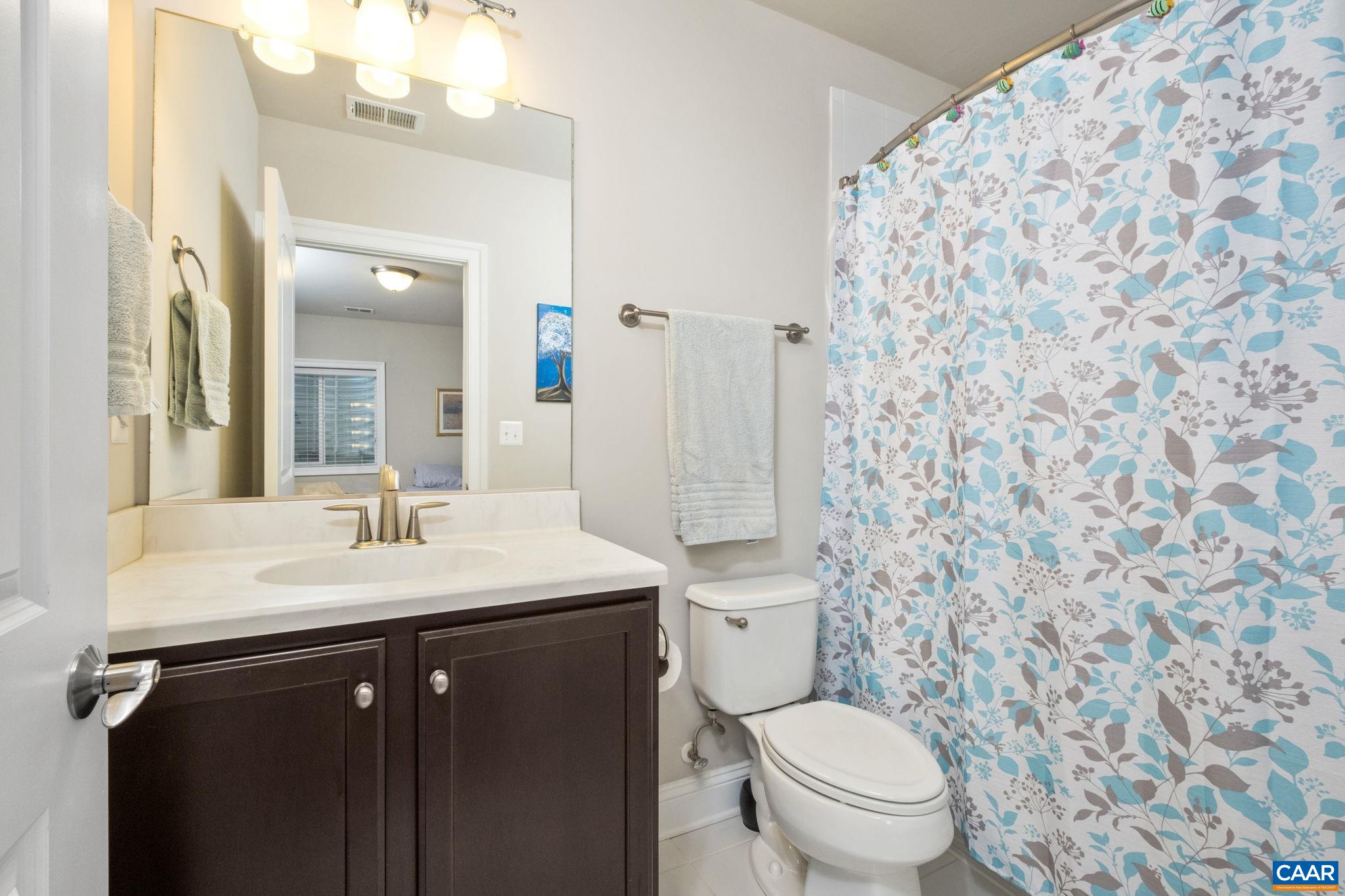 2138 Avinity Loop Charlottesville, VA 22902 - Photo 33 of 49 a bathroom with a toilet sink and mirror