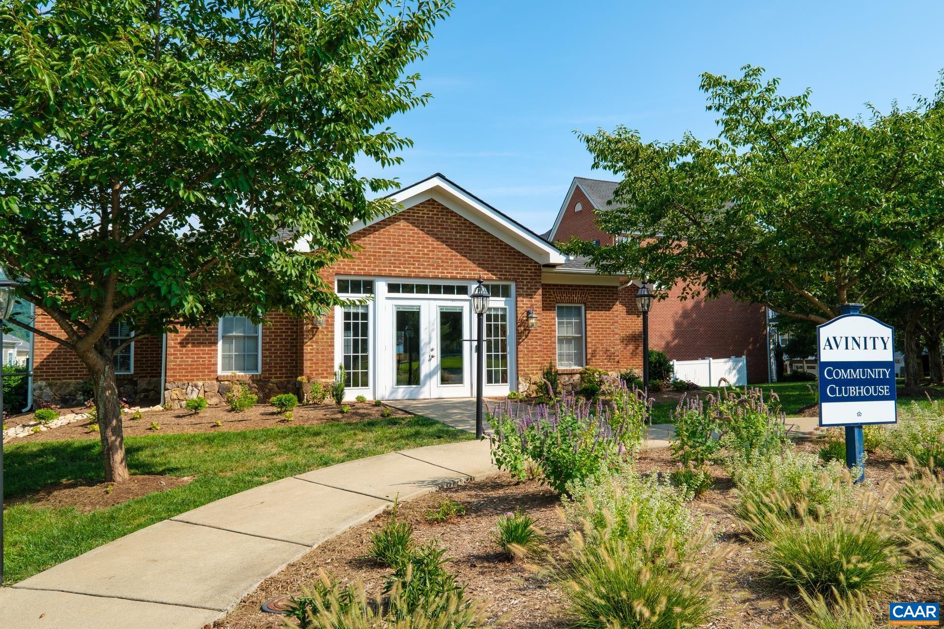 2138 Avinity Loop Charlottesville, VA 22902 - Photo 37 of 49 a front view of a house with a yard and outdoor seating