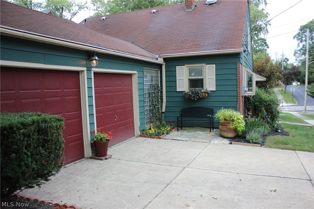 2536 Ashurst Road University Heights, OH 44118 - Photo 22 of 22 ATTACHED 2-CAR GARAGE, ANOTHER PATIO AND NOTE THE SIDE ENTRY WALK TO ASHURST ROAD.