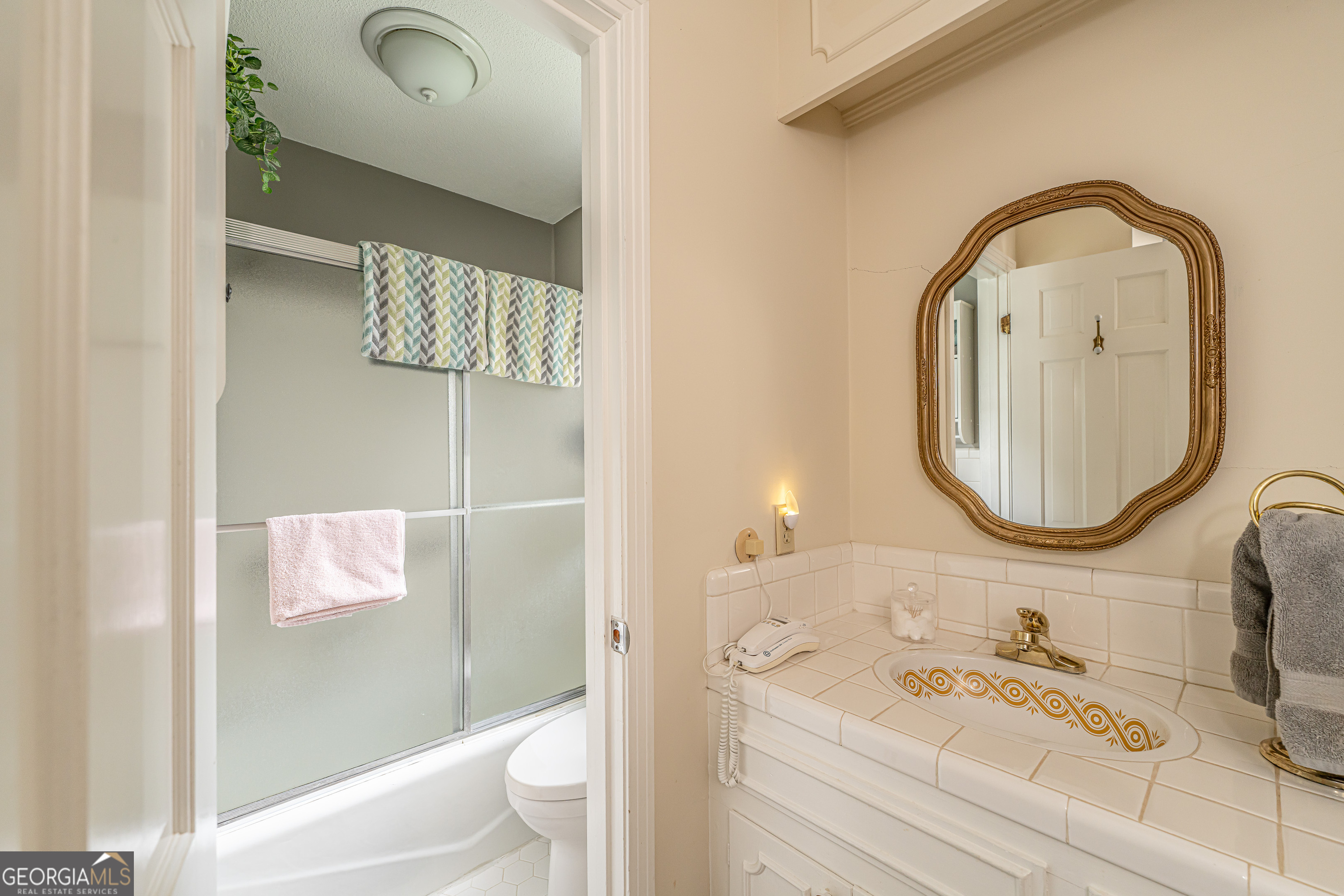 16 Cinnamon Lane Northeast Rome, GA 30161 - Photo 14 of 23 a bathroom with a sink a toilet and shower