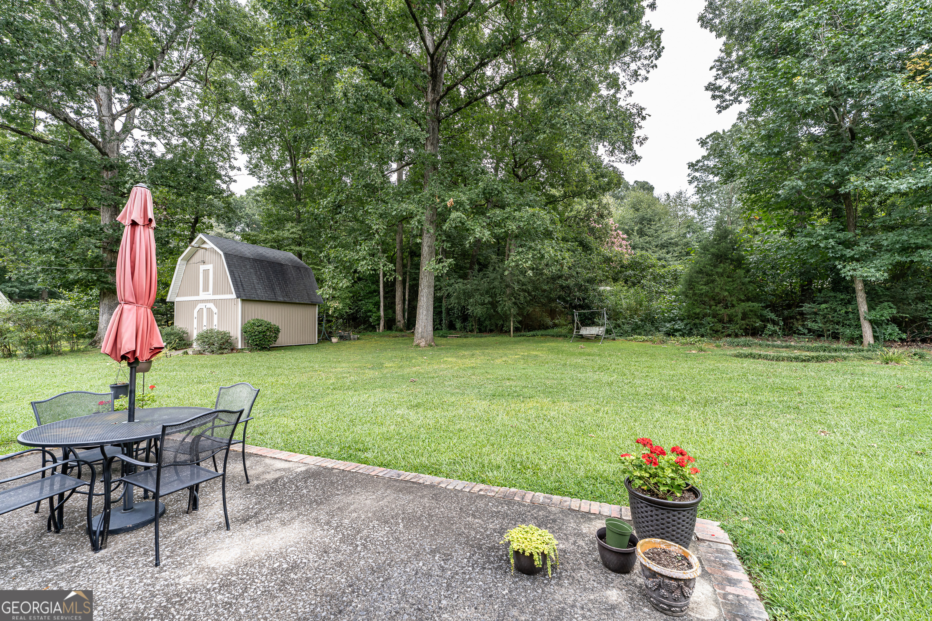 16 Cinnamon Lane Northeast Rome, GA 30161 - Photo 22 of 23 a view of a house with backyard and sitting area