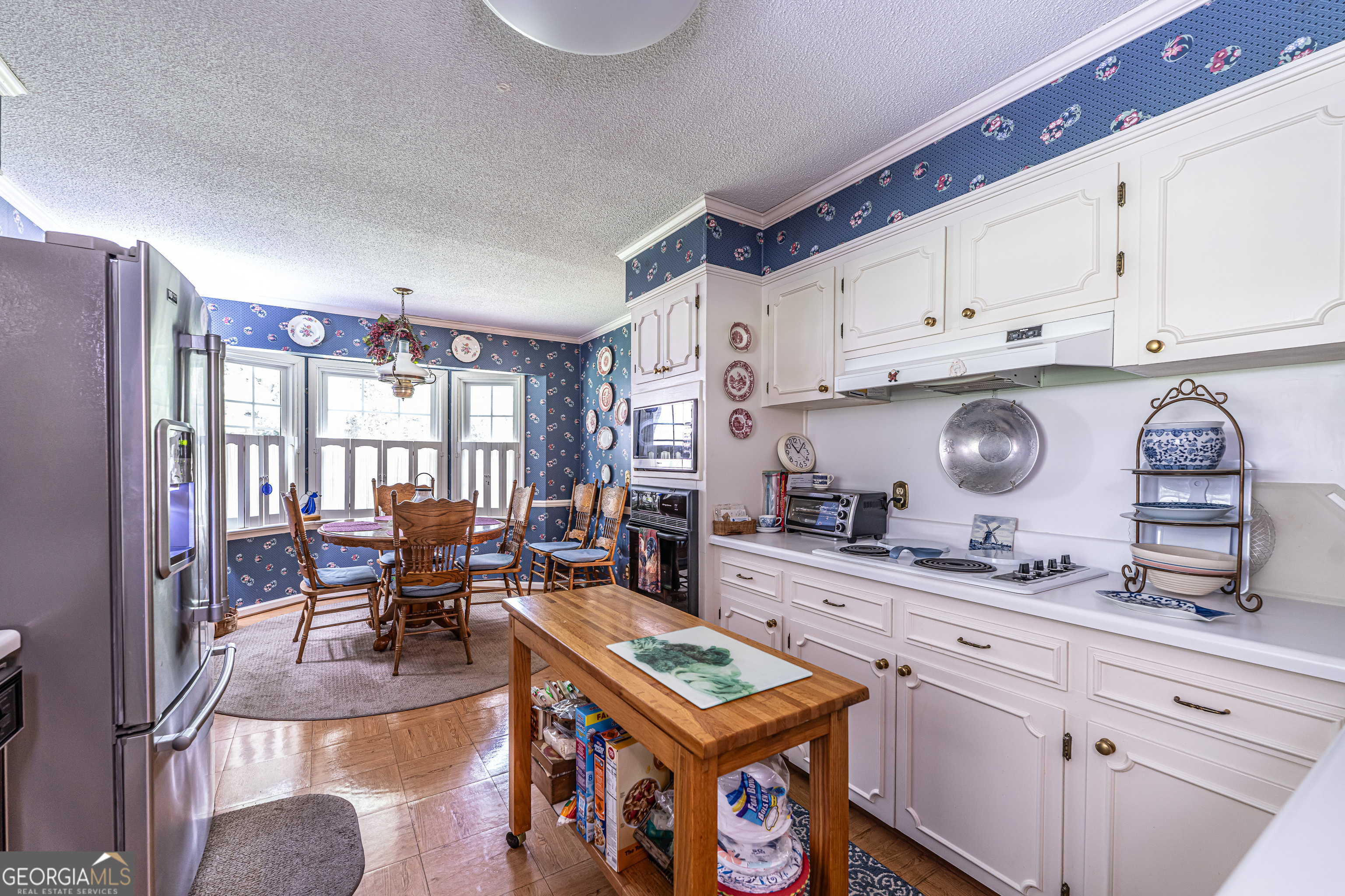 16 Cinnamon Lane Northeast Rome, GA 30161 - Photo 8 of 23 a kitchen with stainless steel appliances granite countertop a stove a sink dishwasher and cabinets with wooden floor