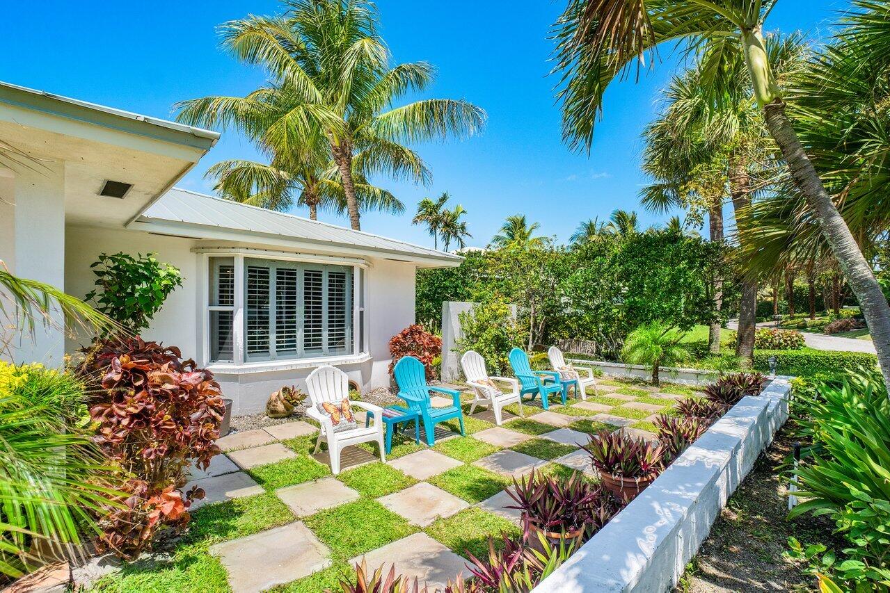 33 Ocean Drive Jupiter Inlet Colony, FL 33469 - Photo 11 of 30 a view of a house with backyard sitting area and garden