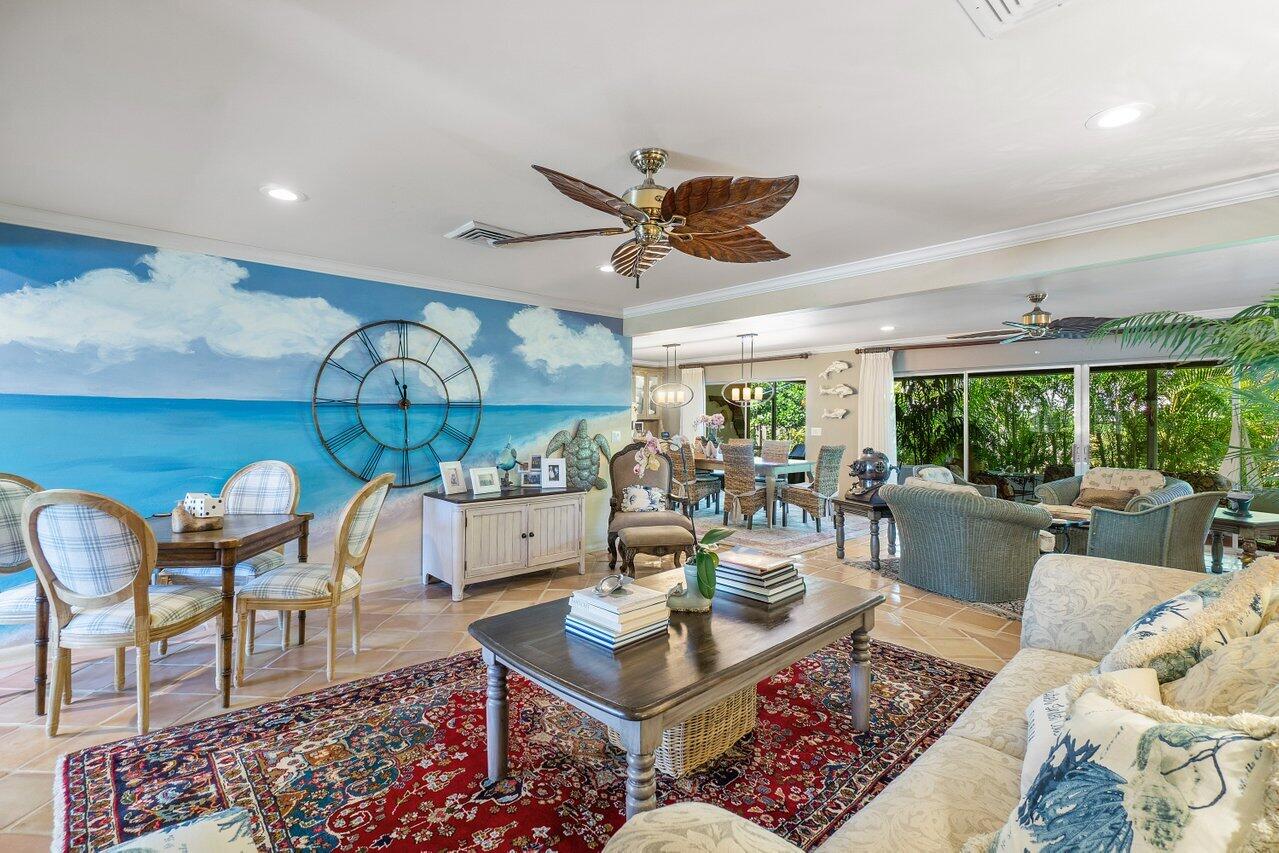 33 Ocean Drive Jupiter Inlet Colony, FL 33469 - Photo 13 of 30 a living room with furniture and a large window