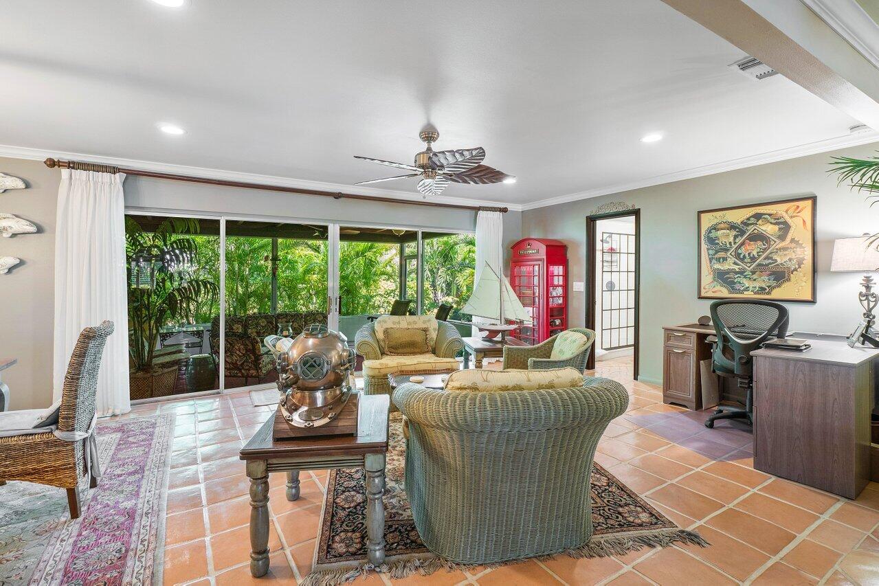 33 Ocean Drive Jupiter Inlet Colony, FL 33469 - Photo 15 of 30 a living room with fireplace furniture and a large window
