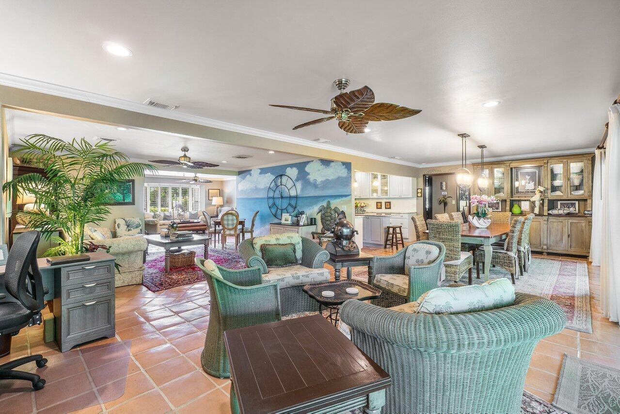 33 Ocean Drive Jupiter Inlet Colony, FL 33469 - Photo 16 of 30 a living room with lots of furniture and a large window