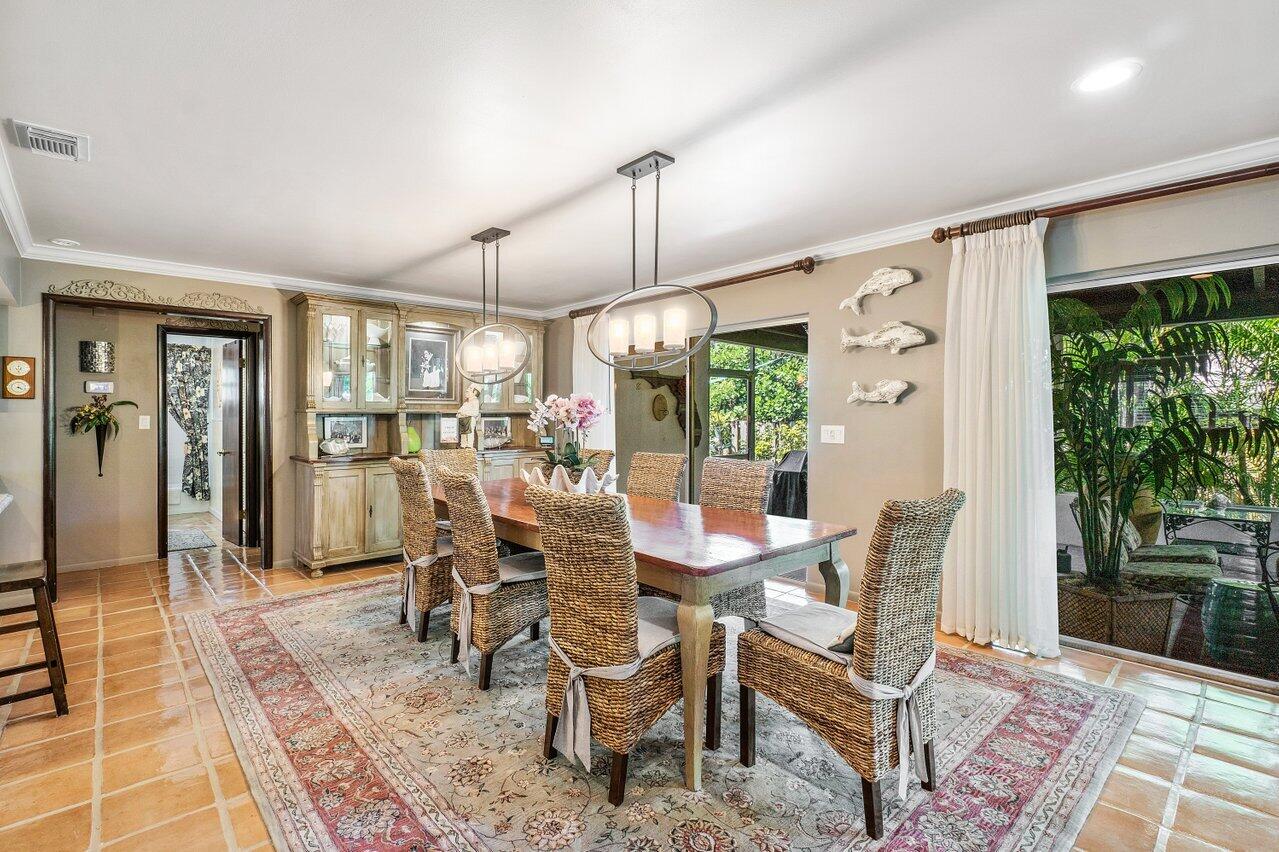 33 Ocean Drive Jupiter Inlet Colony, FL 33469 - Photo 17 of 30 a dining room with furniture and window