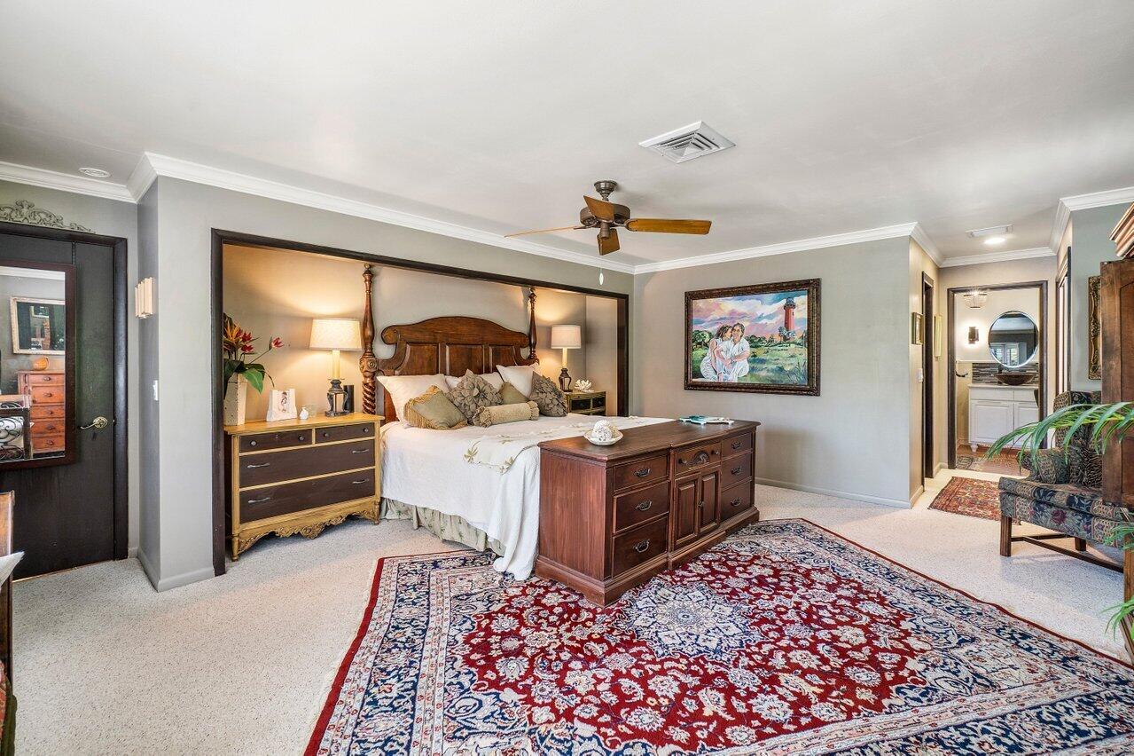 33 Ocean Drive Jupiter Inlet Colony, FL 33469 - Photo 20 of 30 a bed room with furniture and a window