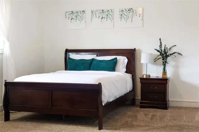 a bathroom with a window and a shower