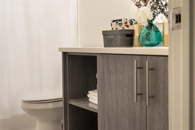 a picture of a bench in front of a wall