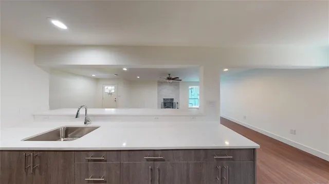 a kitchen with a sink and cabinets