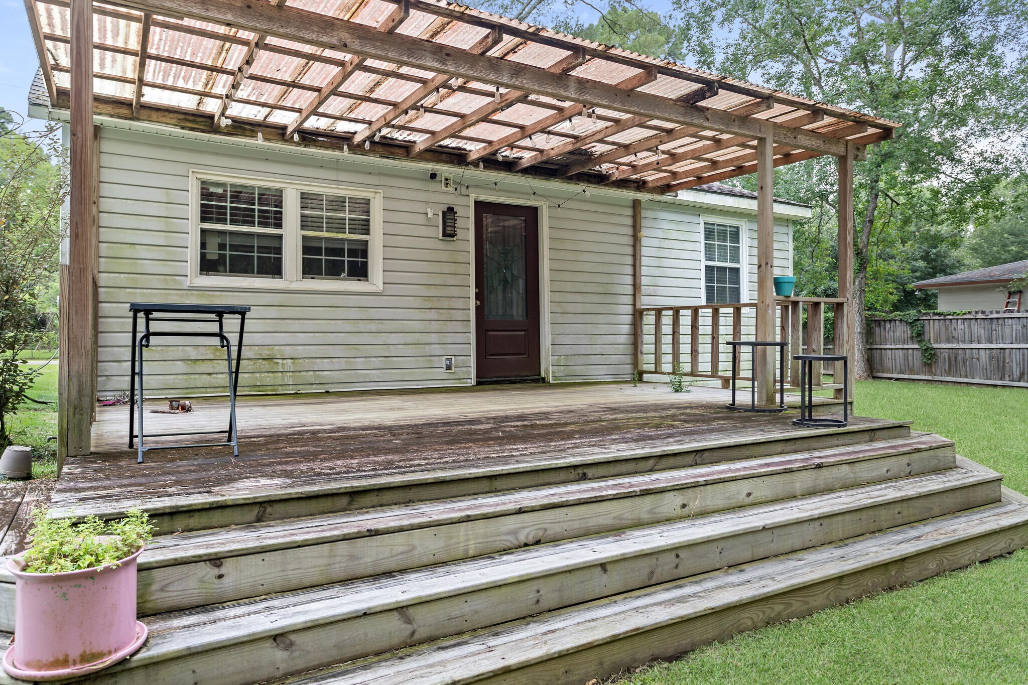 7230 Bythewood Road Beaumont, TX 77713 - Photo 32 of 35 a view of a house with a backyard