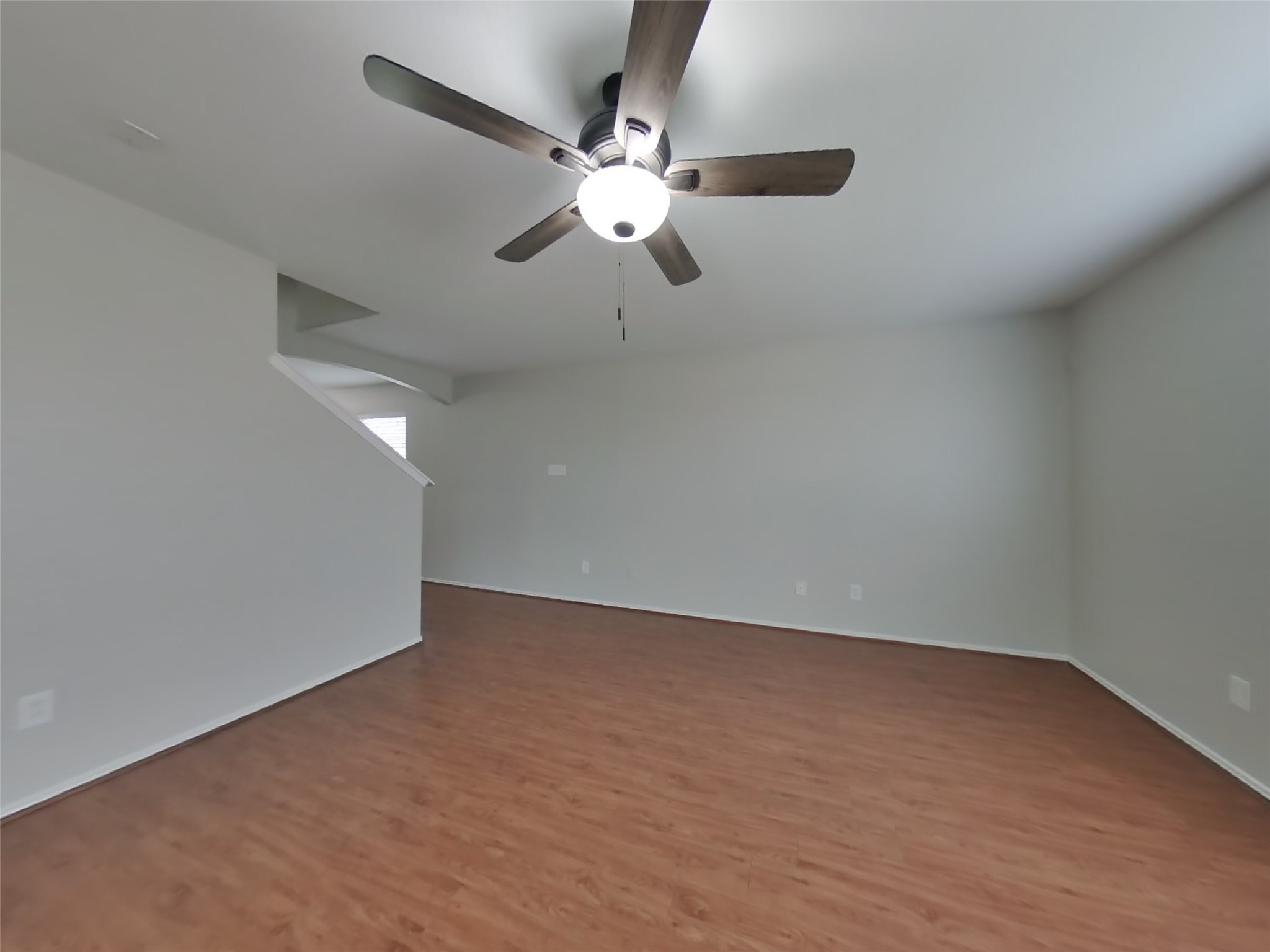 8227 Radial Court Rosharon, TX 77583 - Photo 2 of 16 a view of an empty room with a chandelier fan